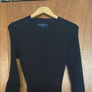 Black midi dress with peep hole in back.